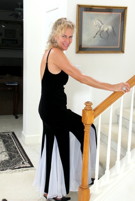 Older mature Sabrina drops long dress to spread legs wide open in stockings