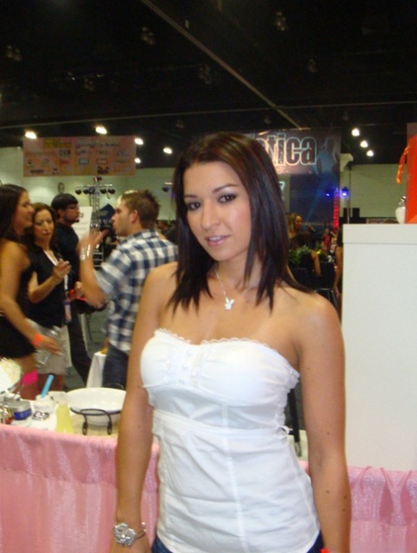 Latina MILF Ann Marie Rios is captured in candid action at a XXX convention