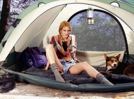 Leggy blonde Jessica Drake toys her pussy while on a camping trip