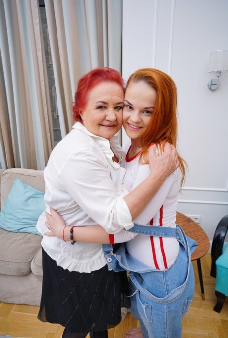 Old and young redheads grind their pussies together during lesbian sex