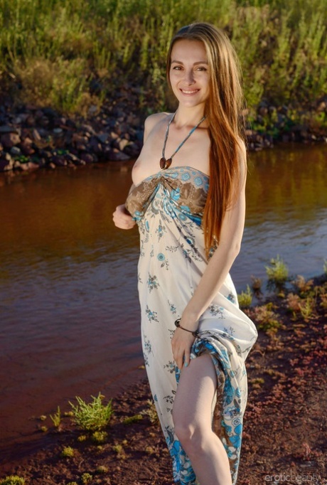 Young girl Selin gets totally naked next to a muddy creek