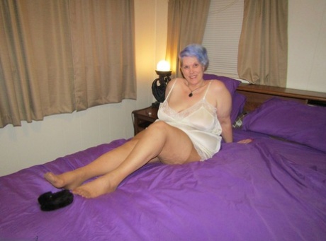 Fat granny Bunny Gram works free of handcuffs before sucking cock on her bed