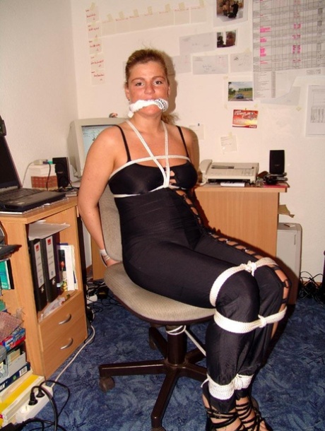 Caucasian girl is cleaved gagged and tied to a chair by her girlfriend