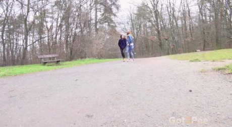 Best friends Esperansa & Chrissy Fox squat to pee near a bench in a park