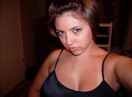 Chubby amateur with short hair and big tits takes a series of self shots