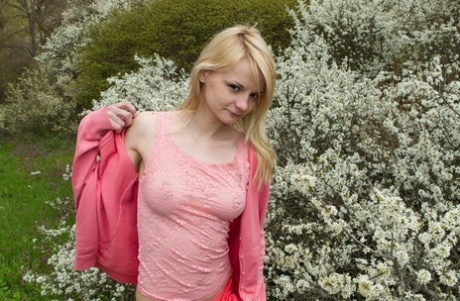 Skinny teen Kira S proudly parts her hairy pussy on a walk in countryside