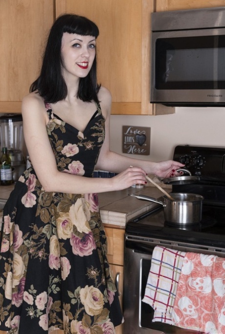 Dark haired amateur Little Olive dildos her full bush on the kitchen counter