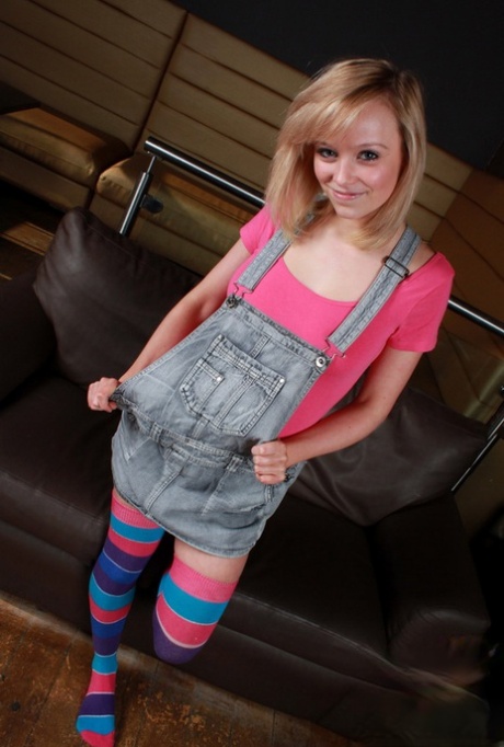 Cute teen Rachel Tease unveils her firm tits while wearing striped thigh highs