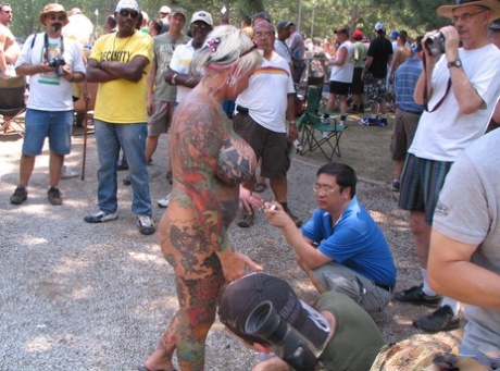 Candid behind-the-scenes action during a stripshow at a clothing optional club