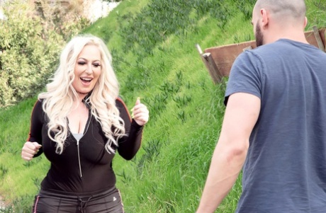 Blonde bombshell Stassi Rossi seduces an injured man on a walking path