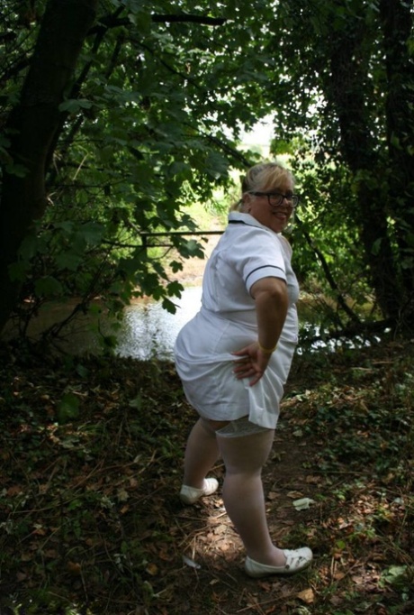 Obese blonde nurse Lexie Cummings has sex with two men in the woods