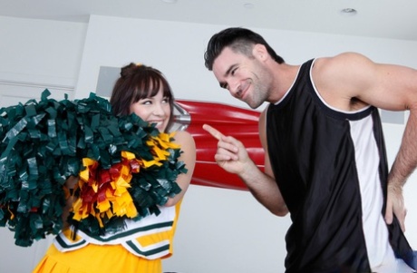 Brunette cheerleader Lindy Lane has sexual intercourse on a black couch