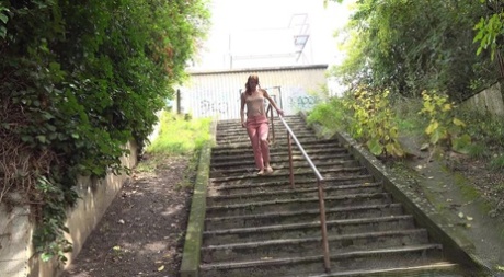 Chrissy Fox checks behind her while peeing on a flight of public steps