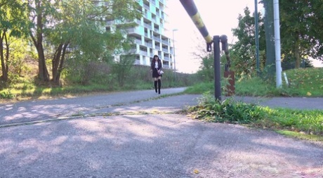 Solo girl Katy Rose squats for a piss on a street in over the knee boots