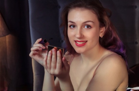 Beautiful teen Isabele sports red lips during a nude modelling session