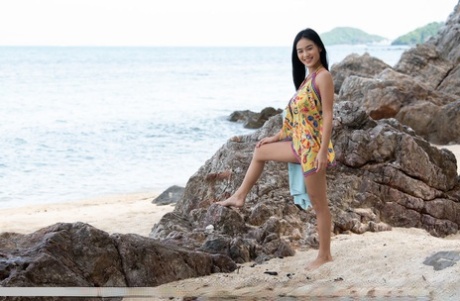 Dark haired teen Kahlisa strikes confident nude poses in and out of the ocean