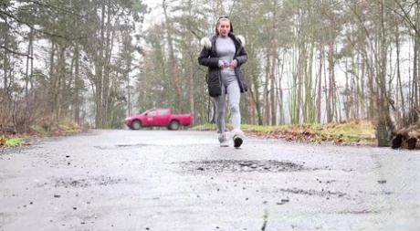 Victoria Daniels takes an urgent piss on a roadway in winter boots