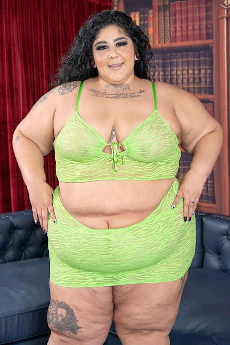 SSBBW Crystal Blue strips down to her footwear on a sofa during solo action