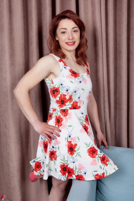 Over 30 redhead Francheska Divine removes a summer dress for her first nudes