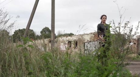 Distressed girl Kristina slips inside an abandoned building to take a pee