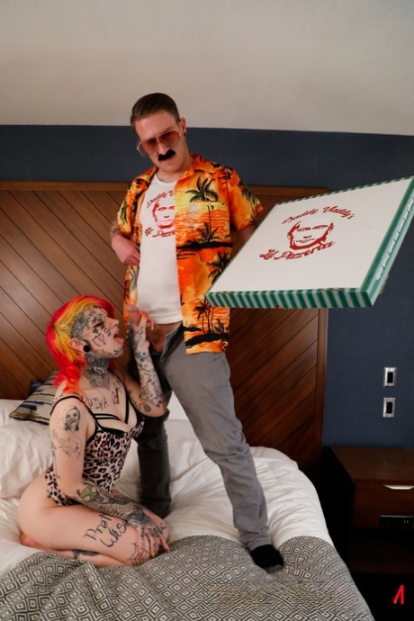 Tattooed redhead Mami ends up on top during sex on a bed