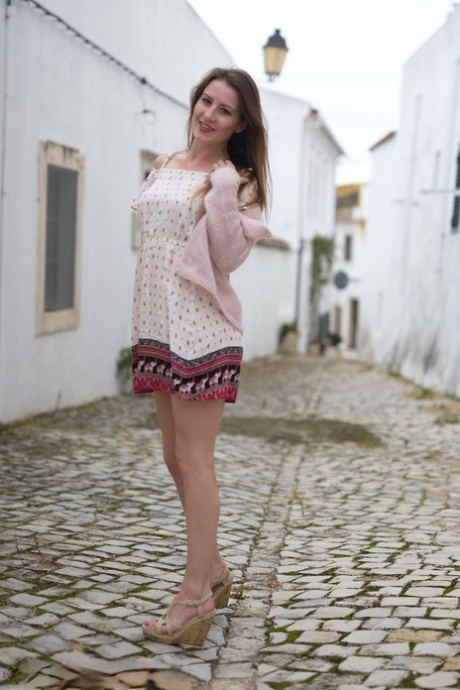 British model Scarlot Rose exposes her upskirt panties on a cobblestone street