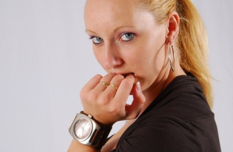 Blonde amateur Oozoo displays her big Oozoo watch before being handcuffed