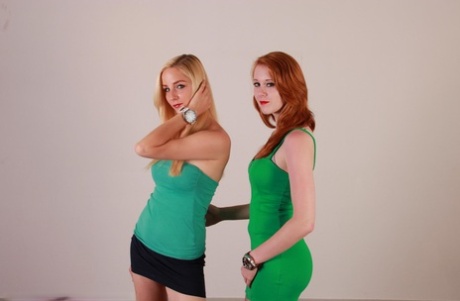 Lesbian girls Eva and Amanda display their Oozoo watches while fully clothed