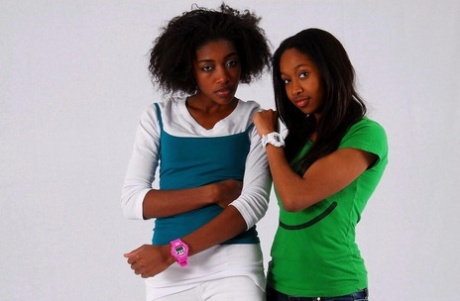 Lesbian sistas Deborah and Naomie model A Bathing Ape watches while clothed