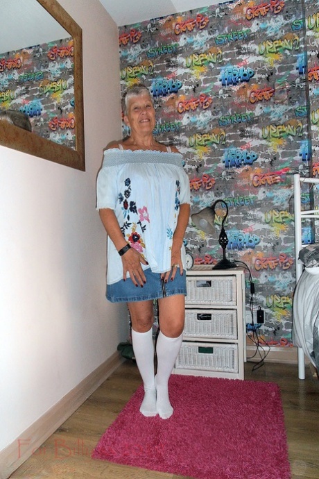 Silver haired granny Savana strips down to white knee socks in her bedroom