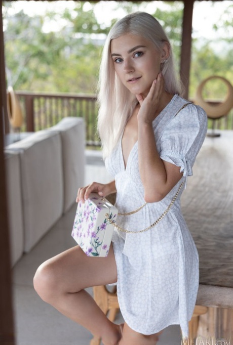 Platinum blonde teen Eva Elfie gets totally naked during a solo engagement