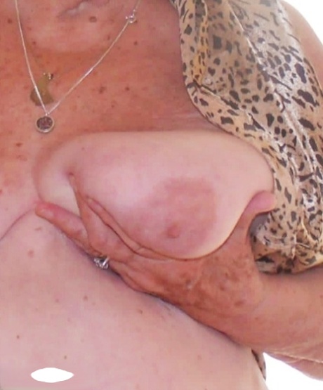 Blonde British granny Grandma Libby fondles her saggy tits during solo action