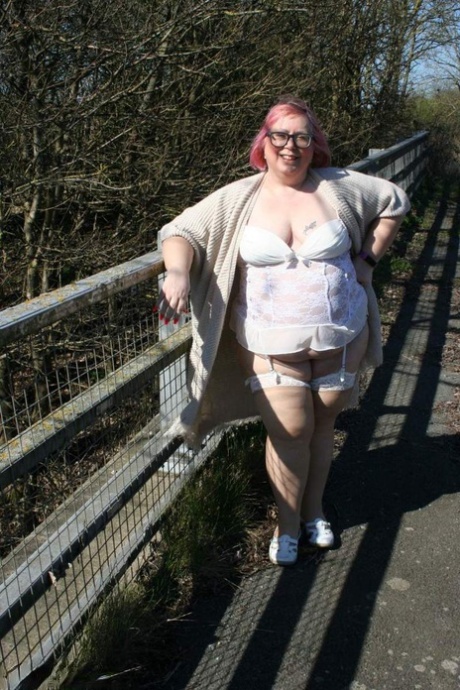 Obese British woman Lexie Cummings shows her tits and ass in public places