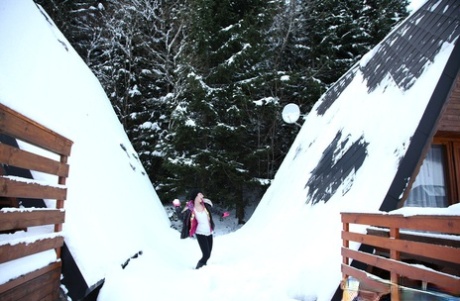 Caucasian teen figures are horny pussy while outside on a snowy day