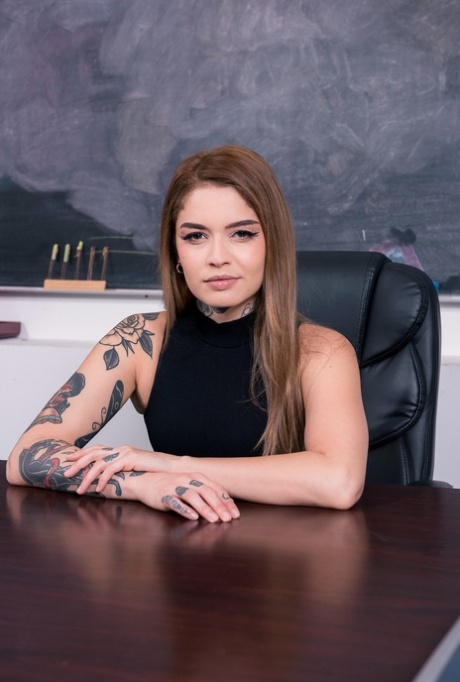 Pretty girl with lots of tattoos Vanessa Vega has sex in a classroom on a desk