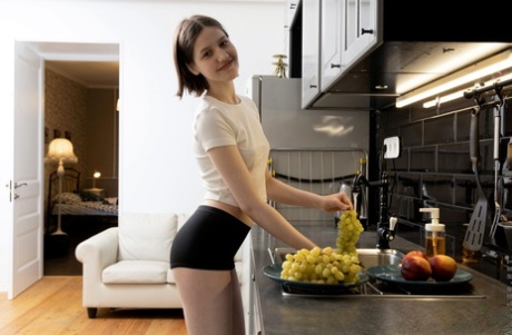 Sweet teen Margo Von Teese masturbates in the kitchen while prepping food