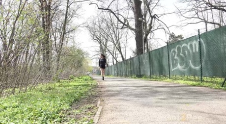 White girl Billie hitches up her skirt before pissing on a paved roadway