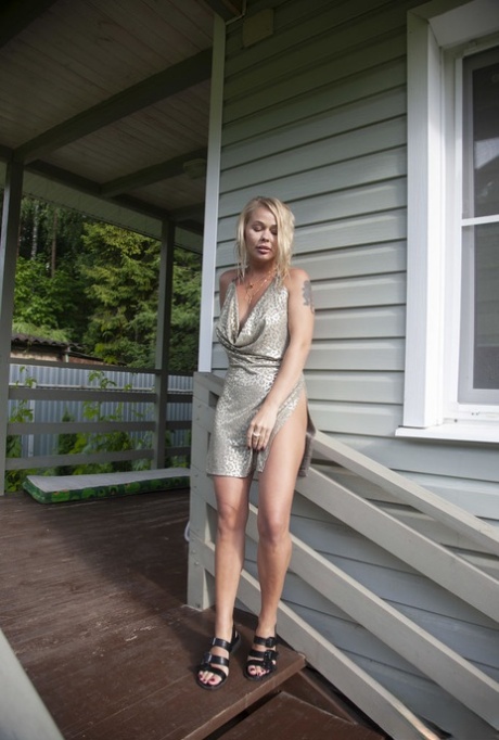 Hot blonde teen Sarika A gets totally naked on a wraparound porch