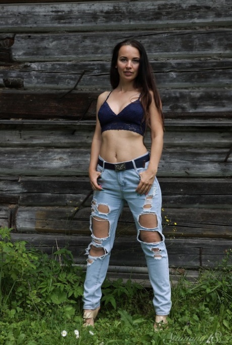 18-year-old Annette Nicole V gets totally naked in front of a rustic building