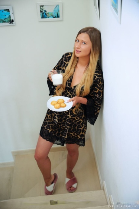 Young blonde Lisa Dawn gets totally naked on her bed over milk and cookies