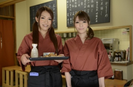 Japanese waitresses Kyoka Makimura and Sakura Aoi go topless at work