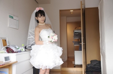 Pretty Japanese bride Ruri Narumiya takes off her wedding dress to pose nude