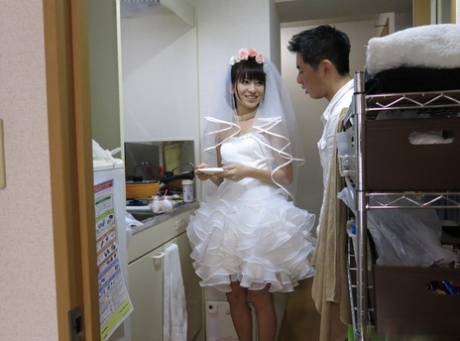 Japanese girl Ruri Narumiya has sex with her man friend in a wedding dress