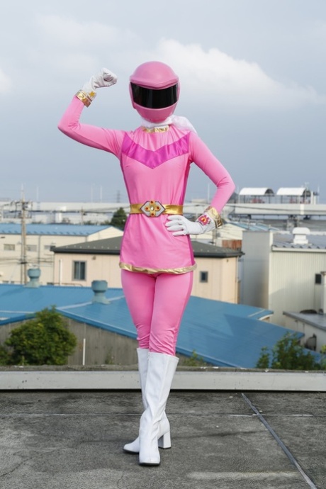 Solo model Sentai Brave poses in futuristic clothing on a rooftop