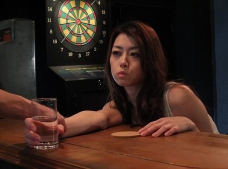Japanese chick Tsubaki Kato has hardcore sex on a bed with a bartender
