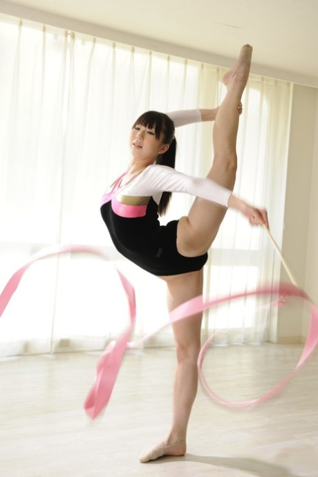 Flexible Asian beauty Haruna puts on a gymnastic routine while getting naked