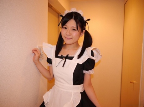 Cute Japanese maid Mai Araki flashes her bald pussy during a solo show