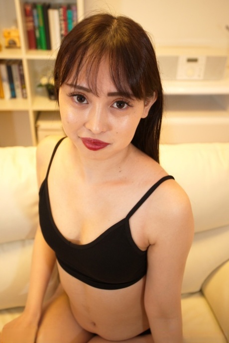 Asian teen Mei Harusaki frees a breast and her snatch from black apparel