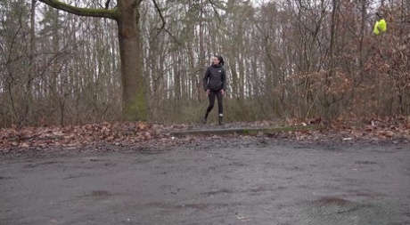 Brunette chick Ali Bordeaux takes a piss over a curb on a wet day