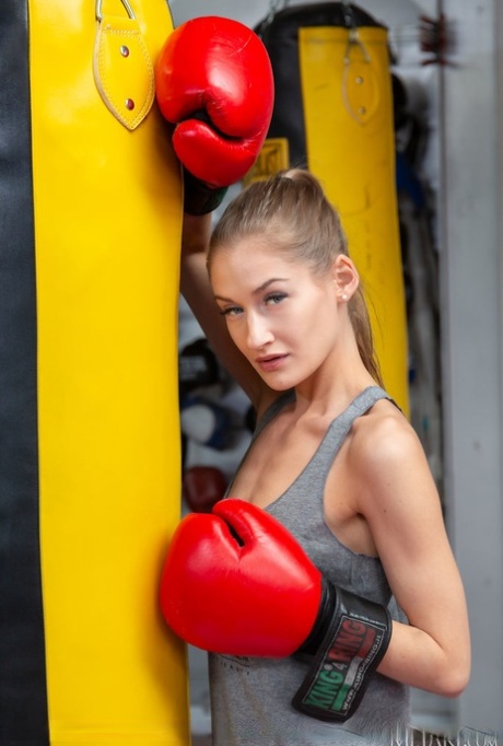 Skinny teen Tiffany Tatum gets naked while wearing boxing gloves